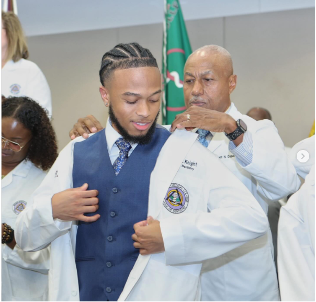 Student receives white coat