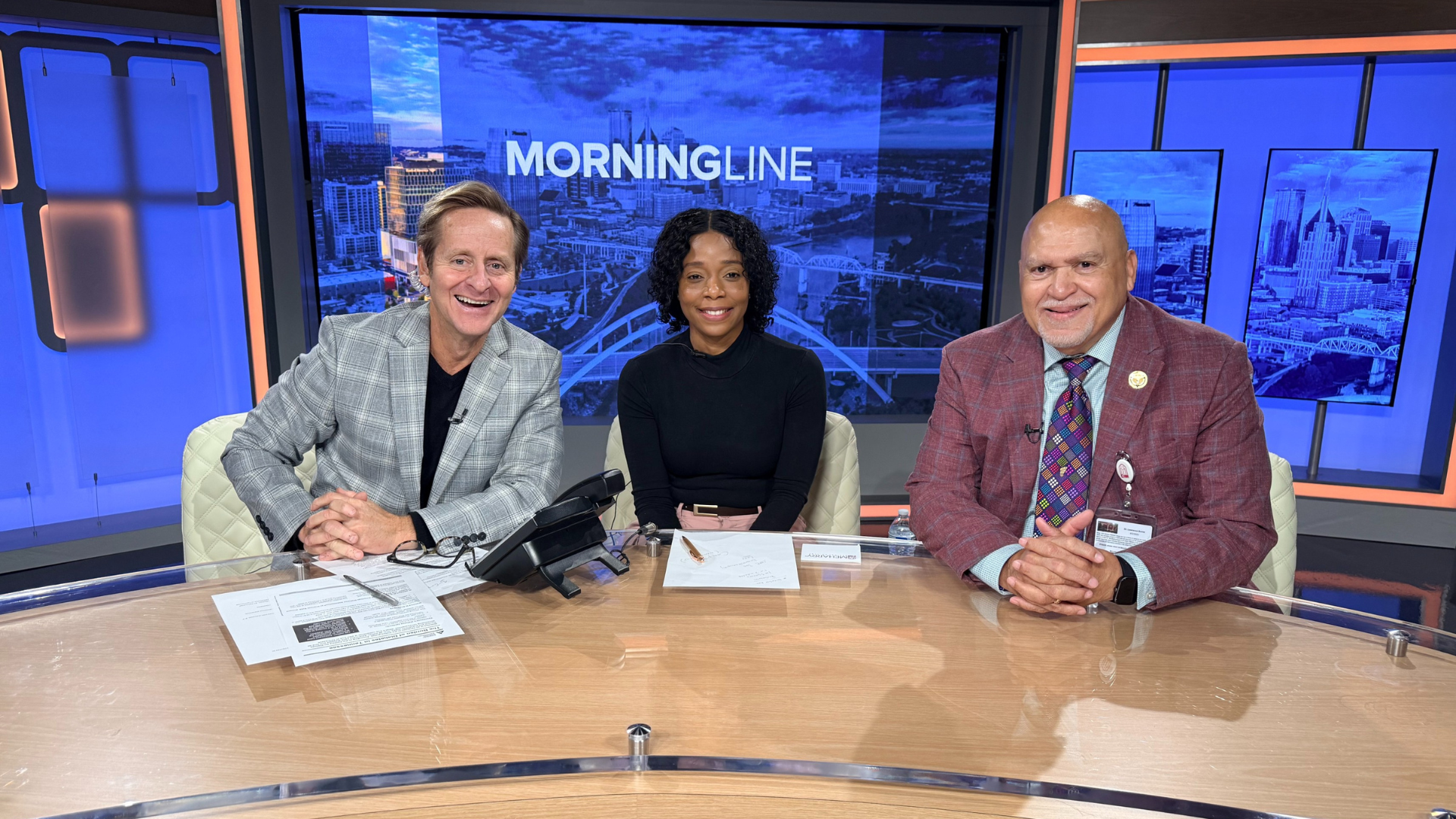 photo of three people smiling.