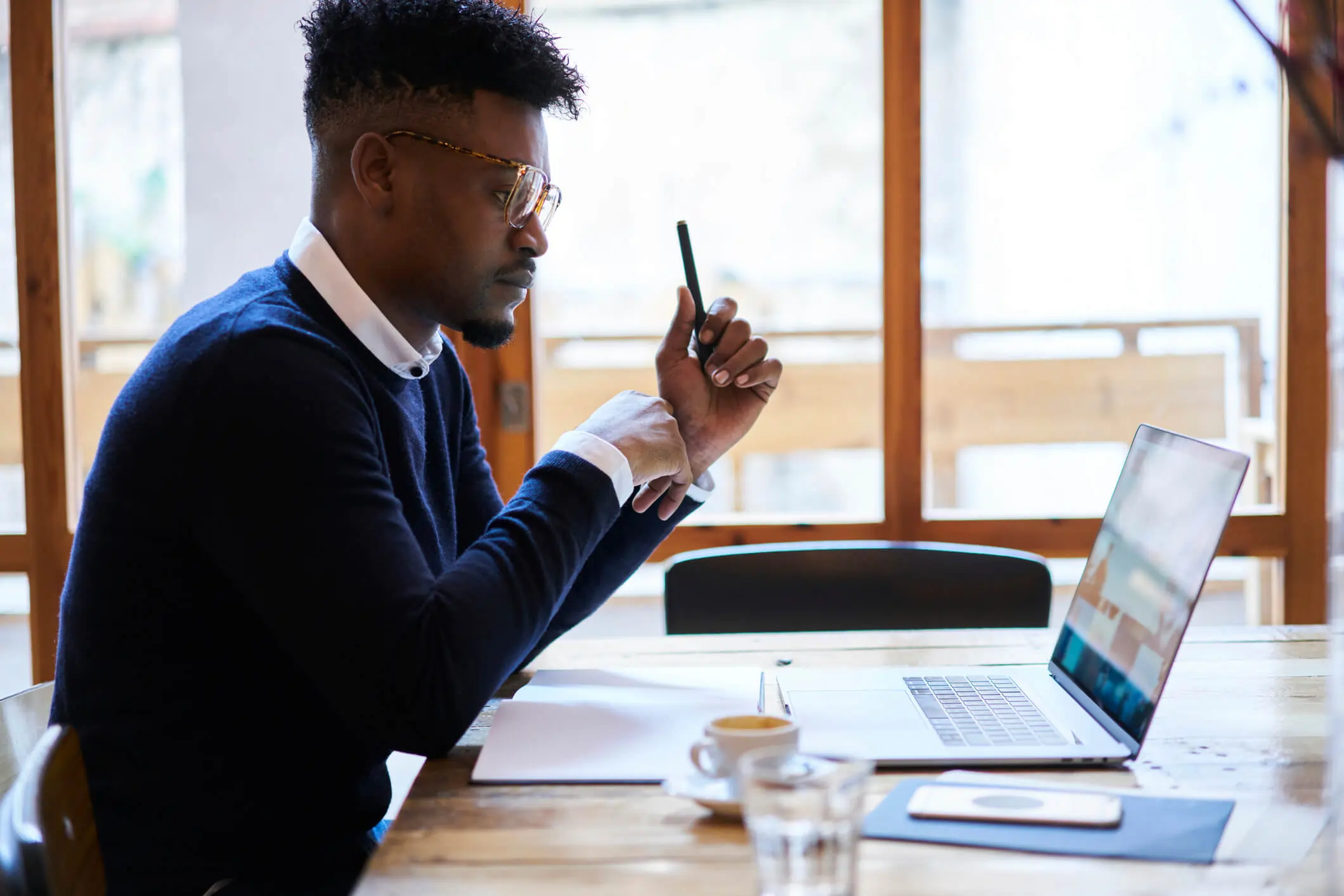 Photo of man working on laptop to represent professional certificate course experience