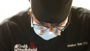 a closeup view of a dentist inspecting their patient
