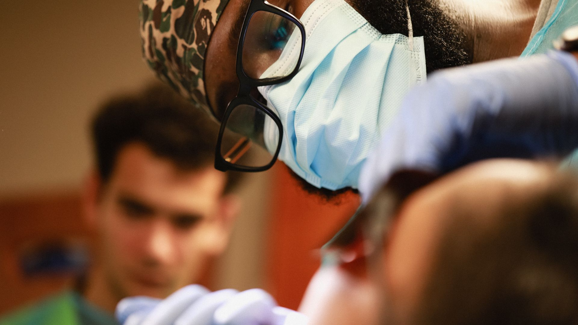 Dental provider performing dental work on patient.