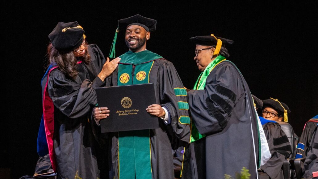 School of Medicine Student Receiving hood during Commencement Ceremony